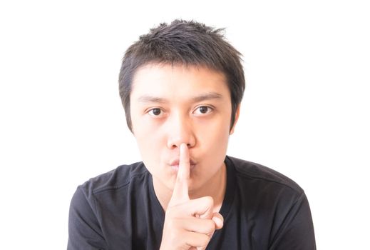 Asian young man with finger for silent concept