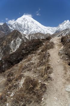 Trekking in Himalaya mountains with snow peaks