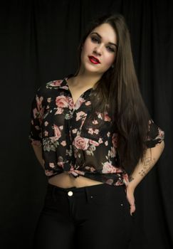 beautiful young woman in her 20s in a close-up portrait in studio