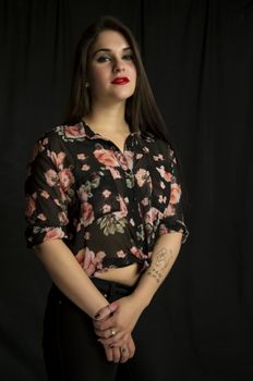 beautiful young woman in her 20s in a close-up portrait in studio