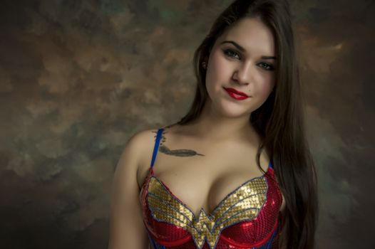 beautiful young woman in her 20s in a close-up portrait in studio