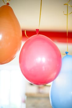 colorful balloons for birthday party hanging at home