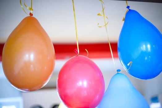 colorful balloons for birthday party hanging at home