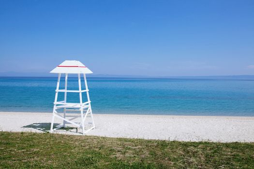 lifeguard tower on an empty beach near the ocean