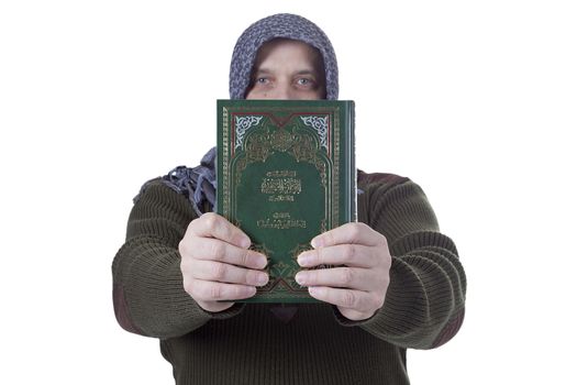 Muslim man with a Quran in hands on a white background