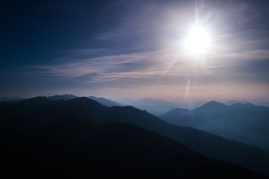 nature scenery, the sun and mountain silhouettes