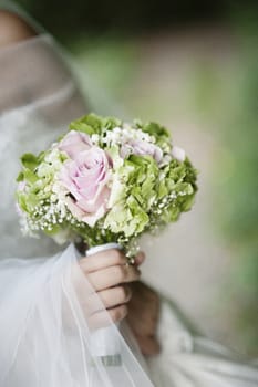 bridal bouquet with white and pink and green flowers, hydrangeas, roses