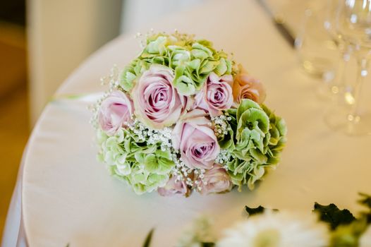 bridal bouquet with white and pink and green flowers, hydrangeas, roses