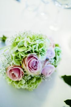 bridal bouquet with white and pink and green flowers, hydrangeas, roses