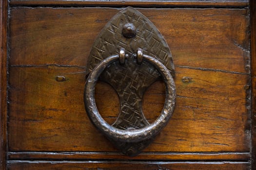 Close up of rustic old door in Spoleto, Italy.