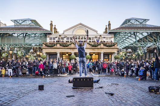LONDON, UK - DECEMBER 29: Covent Garden market, one of the main tourist attractions in London, known as restaurants, pubs, market stalls, shops and public entertaining. On December 29, 2017