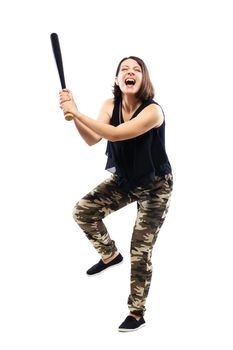 girl in camouflage pants screaming and holding a baseball bat, isolated on white