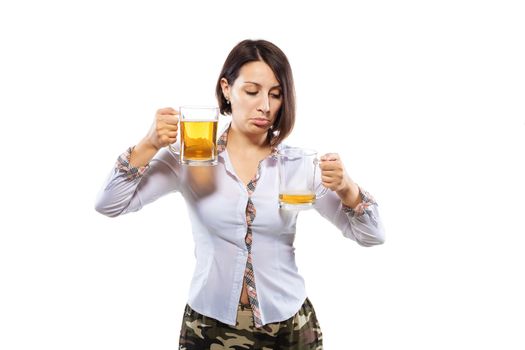 business girl holding two beer glasses against white background