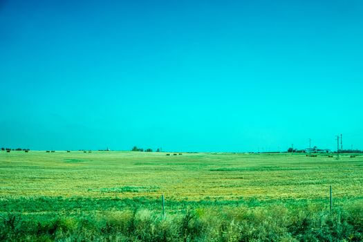 Greenery, Mountains, Farms and Fields on the outskirts of Ronda Spain, Europe on a hot summer day with clear blue skies