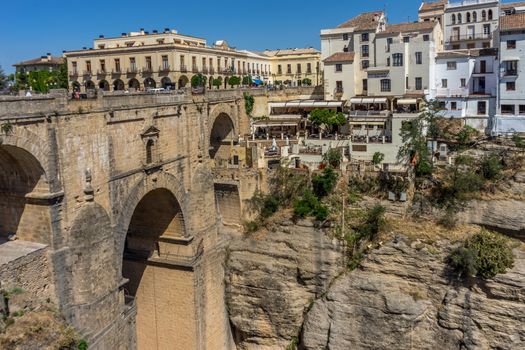 A gorge in the city of Ronda Spain, Europe on a hot summer day with clear blue skies