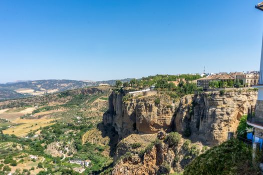 Greenery, Mountains, Farms and Fields on the outskirts of Ronda Spain, Europe on a hot summer day with clear blue skies