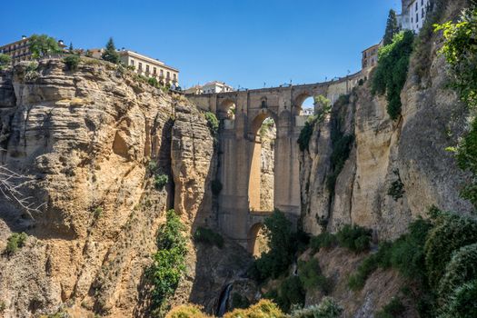 A gorge in the city of Ronda Spain, Europe on a hot summer day with clear blue skies