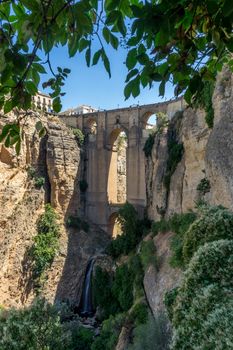 A gorge in the city of Ronda Spain, Europe on a hot summer day with clear blue skies