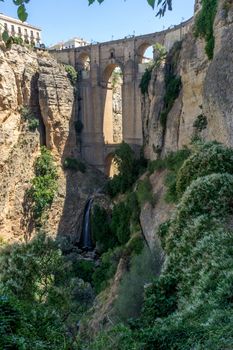 A gorge in the city of Ronda Spain, Europe on a hot summer day with clear blue skies