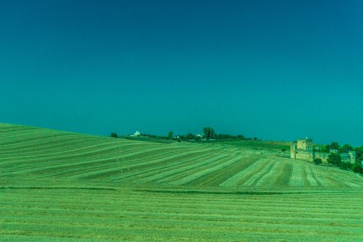 Greenery, Mountains, Farms and Fields on the outskirts of Ronda Spain, Europe on a hot summer day with clear blue skies