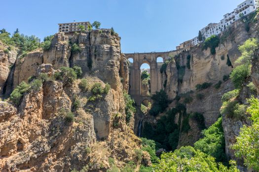 A gorge in the city of Ronda Spain, Europe on a hot summer day with clear blue skies