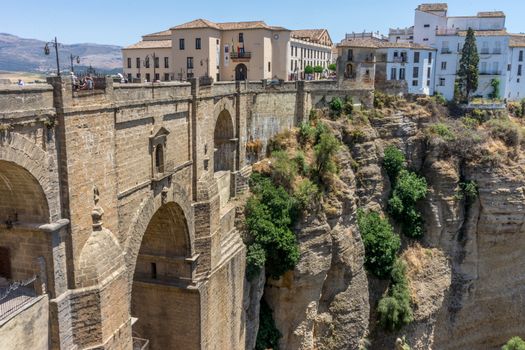 A gorge in the city of Ronda Spain, Europe on a hot summer day with clear blue skies