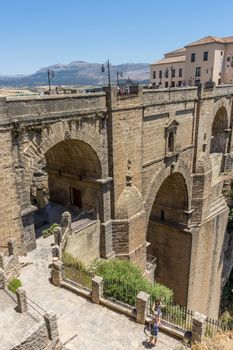 A gorge in the city of Ronda Spain, Europe on a hot summer day with clear blue skies