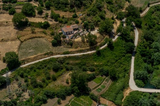 Greenery, Mountains, Farms and Fields on the outskirts of Ronda Spain, Europe on a hot summer day with clear blue skies