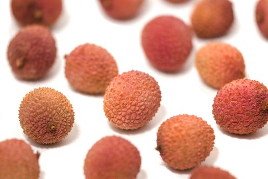 Bunch of Lychee fruits isolated on a white background.