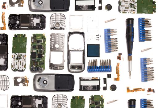Disassembled mobile phone parts isolated on a white background.