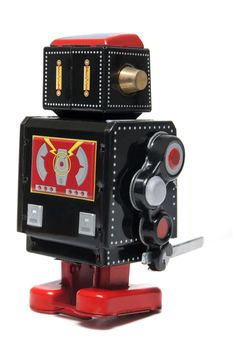 Vintage tin robot toy isolated on a white background.