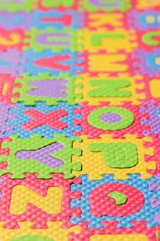 Close up view of foam puzzle letter uppercase game.