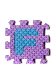 Foam puzzle letter uppercase isolated on a white background.