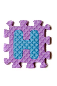 Foam puzzle letter uppercase isolated on a white background.