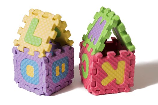 Foam puzzle houses isolated on a white background.
