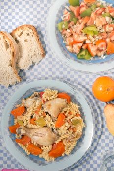 Typical Portuguese meal of Chicken with carrot and spaghetti.