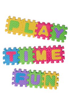 Foam puzzle letter uppercase with word Play Time Fun isolated on a white background.