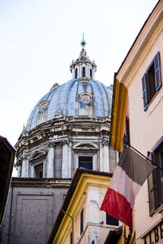 Italy, Rome, the flag of France in Piazza Farnese, the seat of the French embassy, in the background the dome of the church of Santa Maria della Quercia