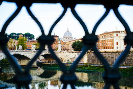 Italy, Rome, City of the Vatican dome of San Pietro seen from the bridge over the Tiber River