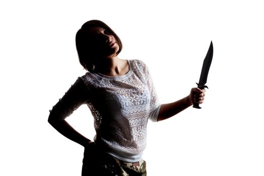 half silhouette girl holding an army knife