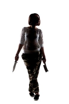 half silhouette girl holding an army knife and a cleaver