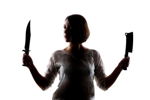 half silhouette girl holding an army knife and a cleaver