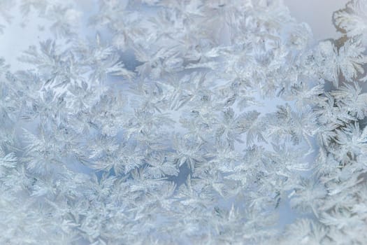 winter window close-up snow patterns on the Windows of frost, snow city