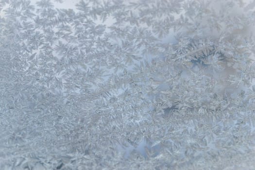 winter window close-up snow patterns on the Windows of frost, snow city