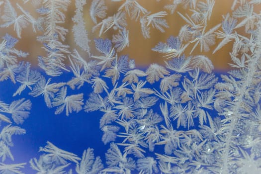 winter window close-up snow patterns on the Windows of frost, snow city