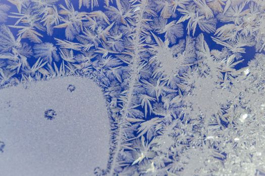 winter window close-up snow patterns on the Windows of frost, snow city