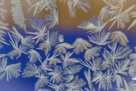 winter window close-up snow patterns on the Windows of frost, snow city