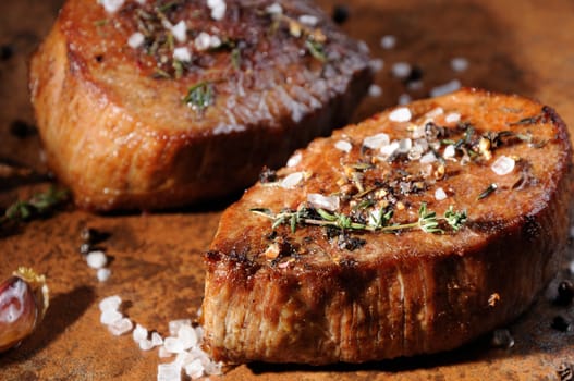 Beef steak. Juicy medium Rib Eye steak slices  herbs spices and salt.