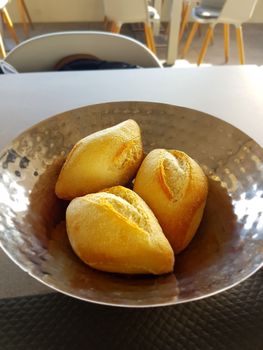 French Bread - Golden Rolls in a Metal Dish
