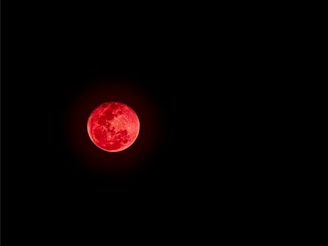 Bloodmoon or red moon,a natural phenomenon, on dark sky